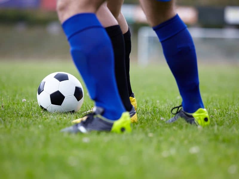 why do football players rip or cut their socks