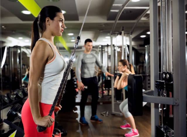 how to get better at football woman at the gym improving her football fitness