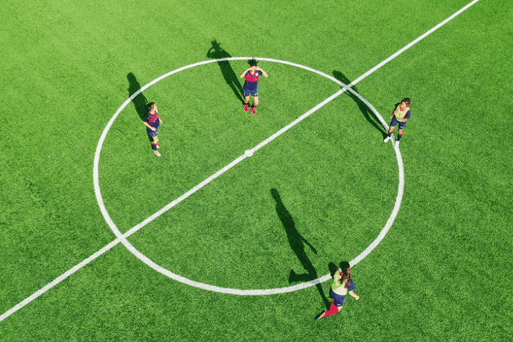 Female players playing football