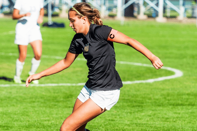 Soccer Girl in Black football shirt Control Kick Approach