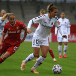 Women Playing Soccer in a Stadium